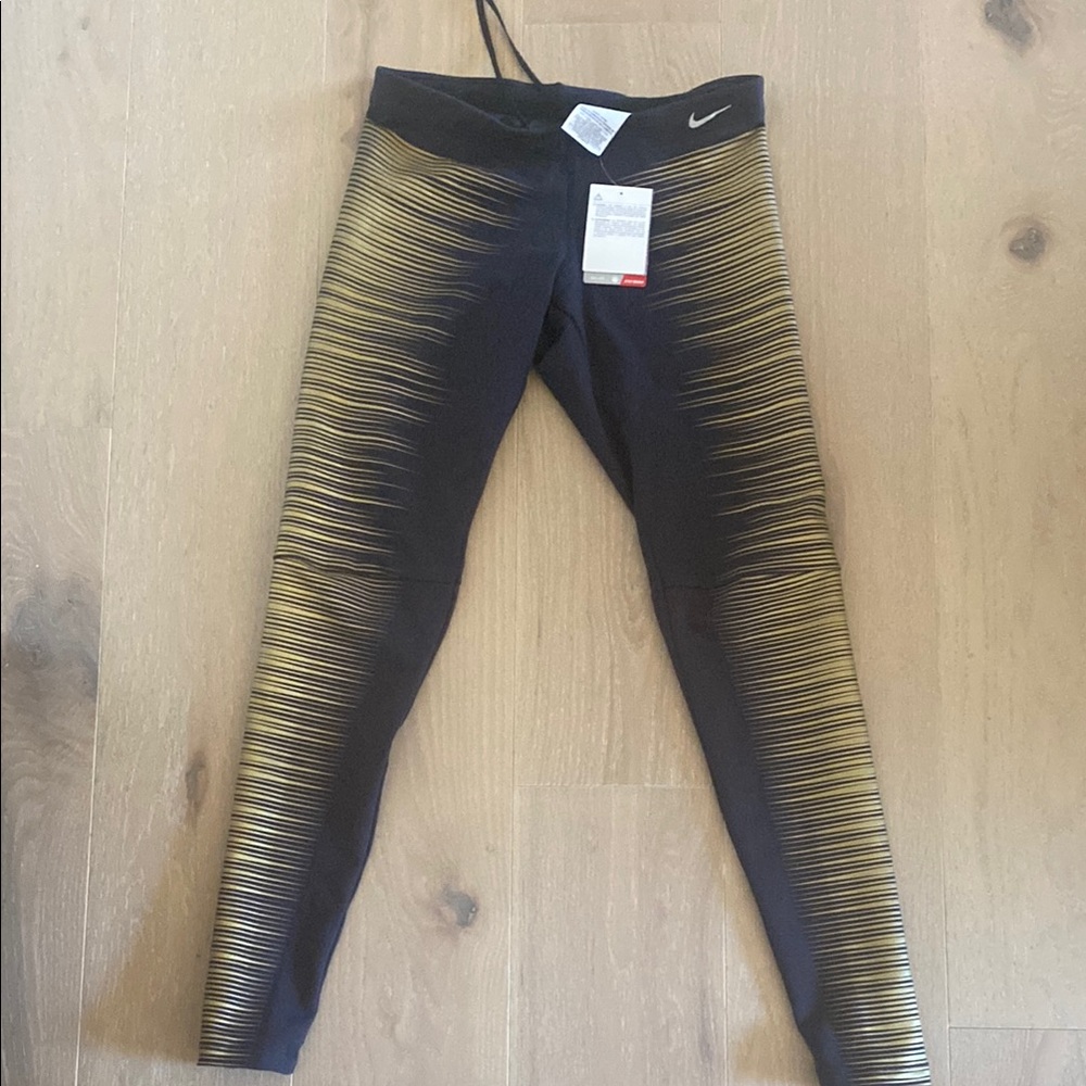 Nike Women’s Black and Gold Leggings